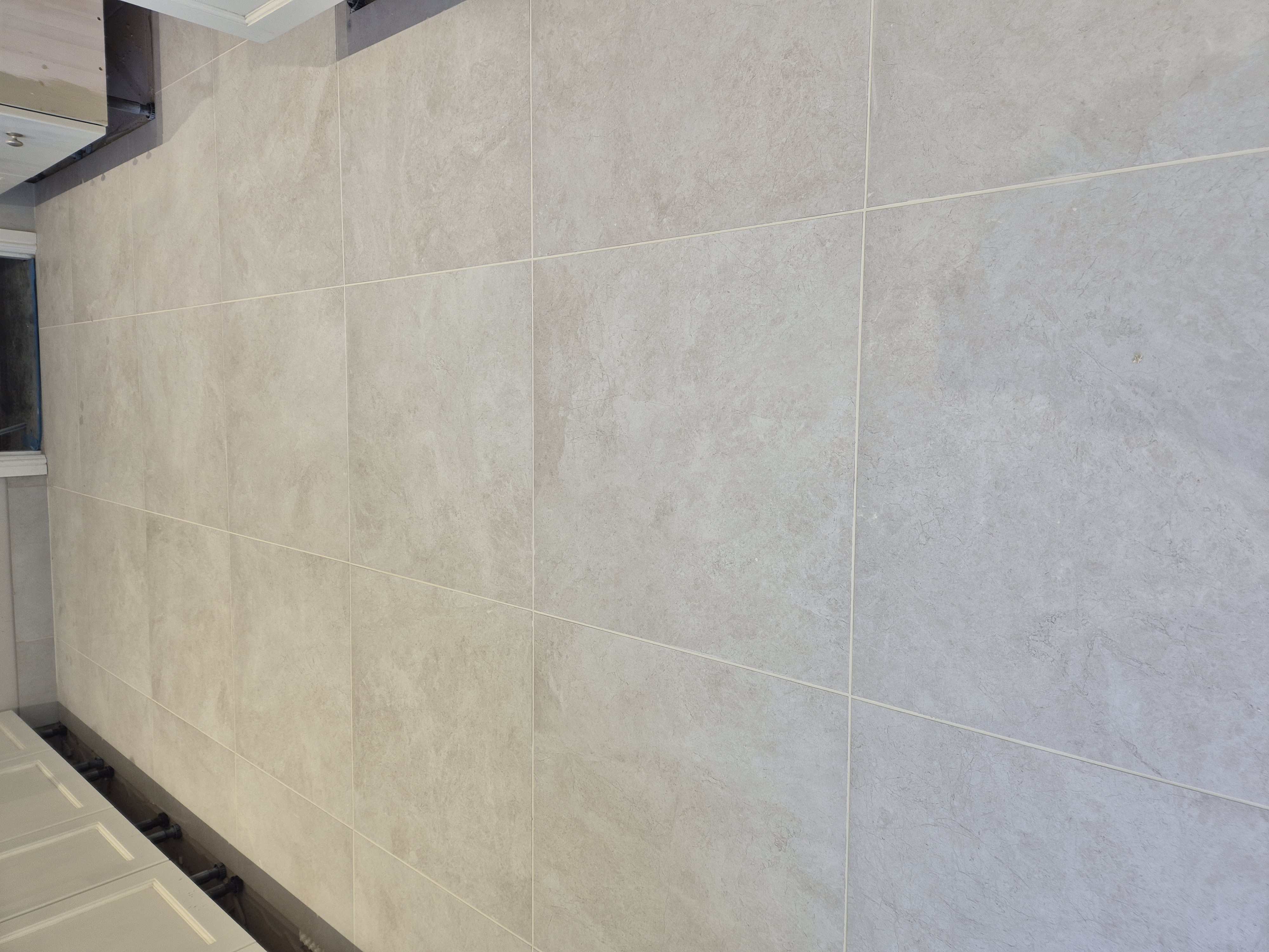 Self-levelling compound poured across kitchen floor in Frodsham